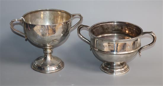 A George V silver two handled trophy bowl and a similar trophy cup, 20 oz.